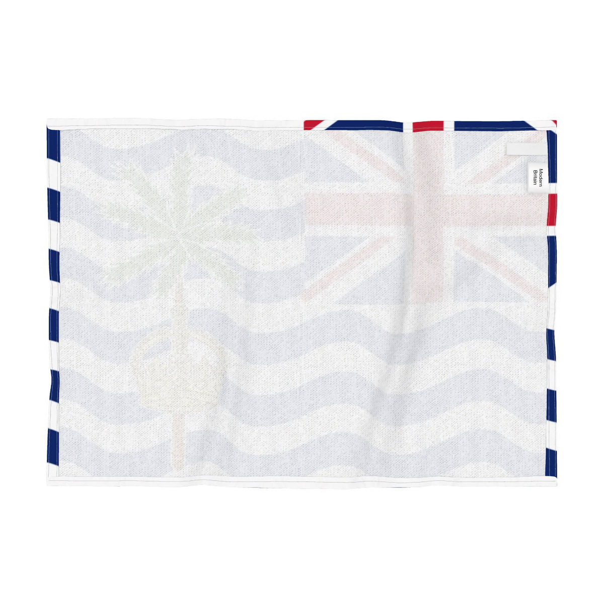 Reverse side of a tea towel of the flag of the British Indian Ocean Territories, featuring a Union Jack in the upper left, blue and white wavy stripes, a green palm tree, and a gold crown, shown flat against a white background.