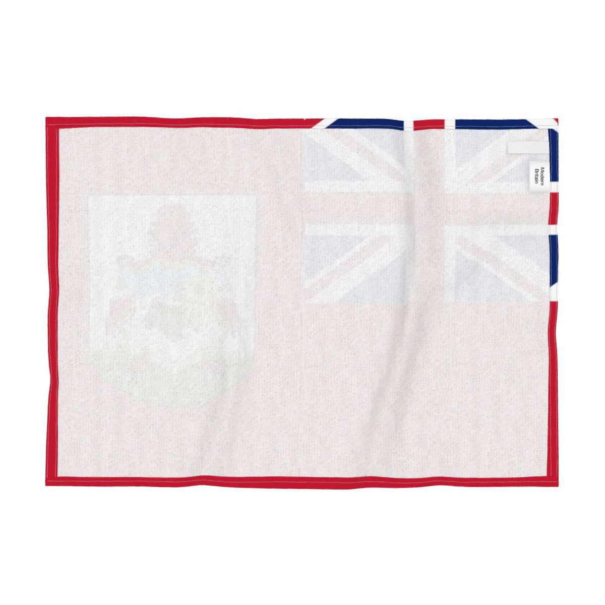 Reverse of the tea towel featuring the national flag of Bermuda with a red field with the Union Jack in the upper left canton and the national coat of arms in the lower right, shown flat against a white background.