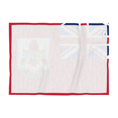 Reverse of the tea towel featuring the national flag of Bermuda with a red field with the Union Jack in the upper left canton and the national coat of arms in the lower right, shown flat against a white background.