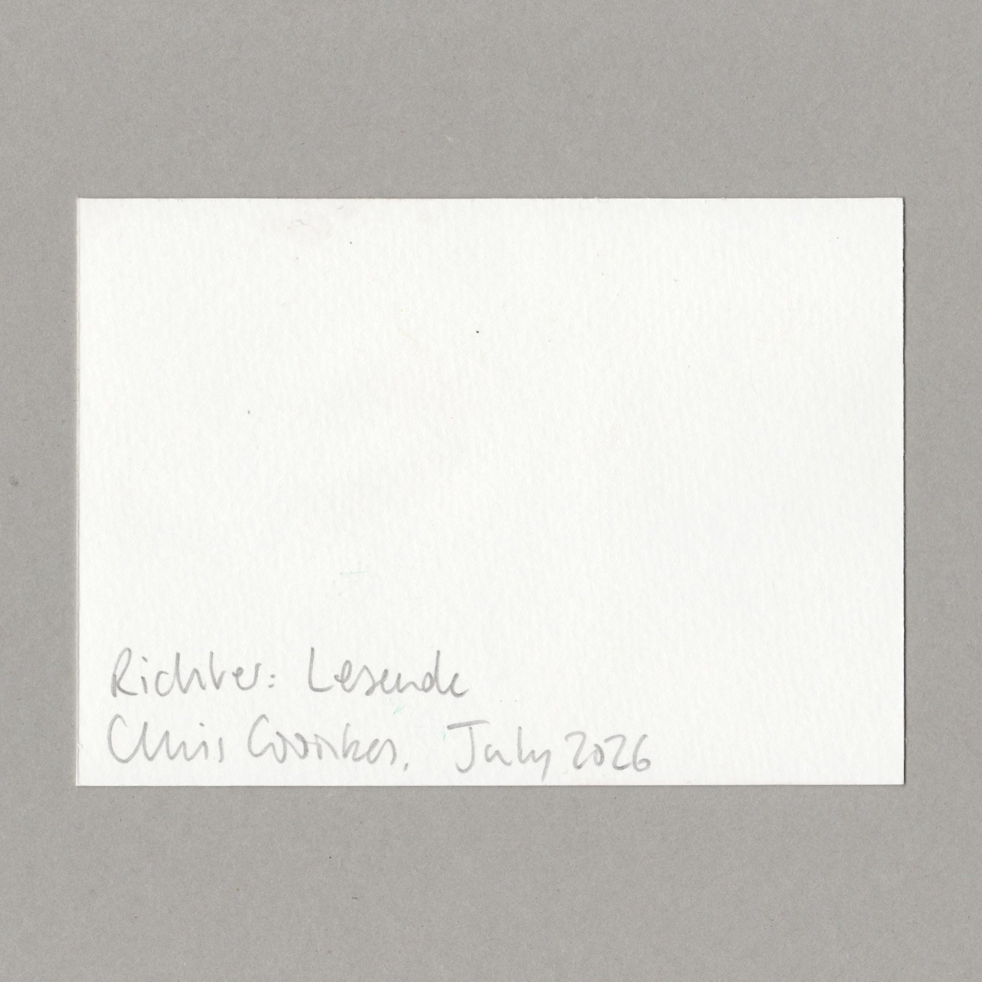 A square white textured paper card with handwritten black ink text in the bottom-left corner, placed on a smooth gray surface. The text reads 'Richter: Lesende' and 'Chris Coombes, July 2026'.