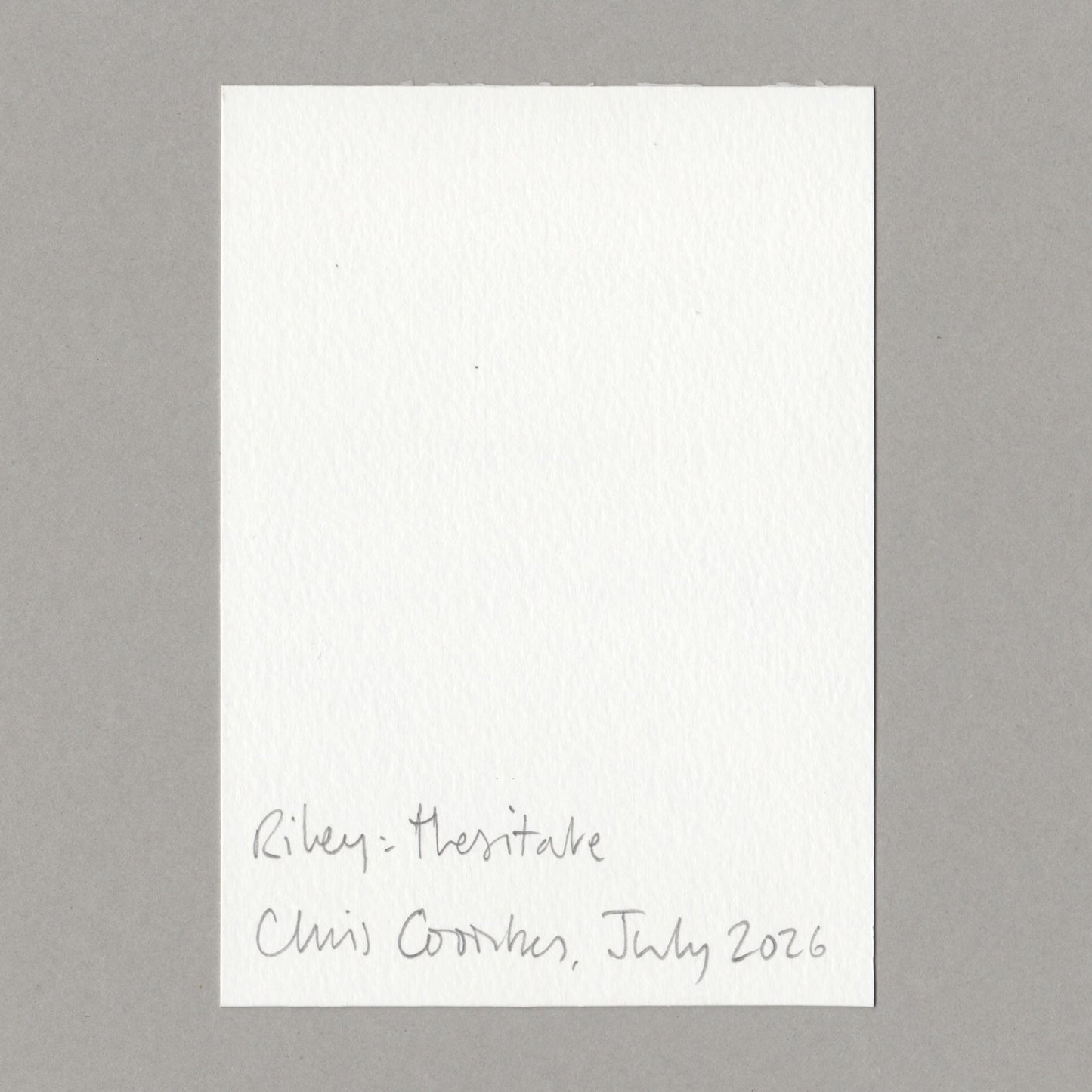 A white art card with handwritten text at the bottom, placed on a neutral gray background. The handwritten text reads 'Riley - Hesitate' and 'Chris Coombes, July 2026'.