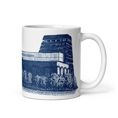 White mug featuring a pen and ink drawing of Tate Modern in dark blue. 