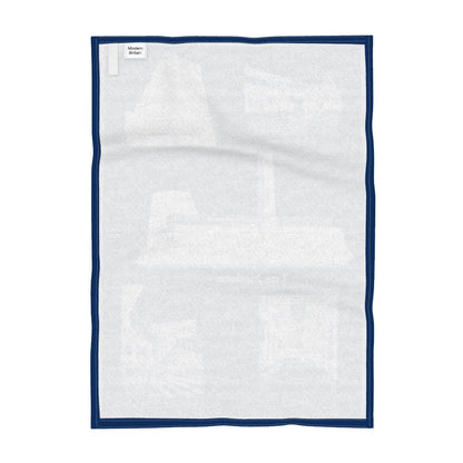 Reverse of tea towel featuring pen and ink drawings of Tate Modern, Blavatnik Building, Turbine Hall, St Pauls Cathedral and Millennium Bridge. 