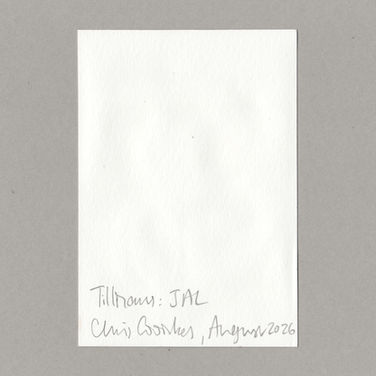 A blank white rectangular card or note with handwritten text at the bottom reading 'Tillmans: JAL Chris Coombes , August 2026', photographed against a plain gray background.